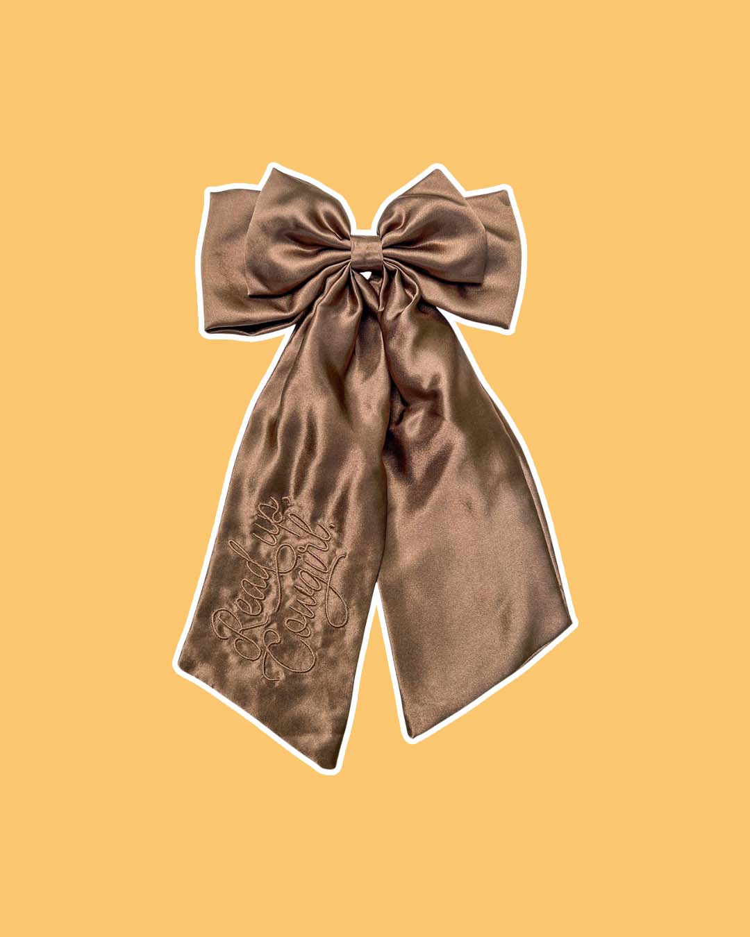 Embroidered satin bow for cowboy romance fans with the text 'Read Up, Cowgirl' in a beautiful brown color.