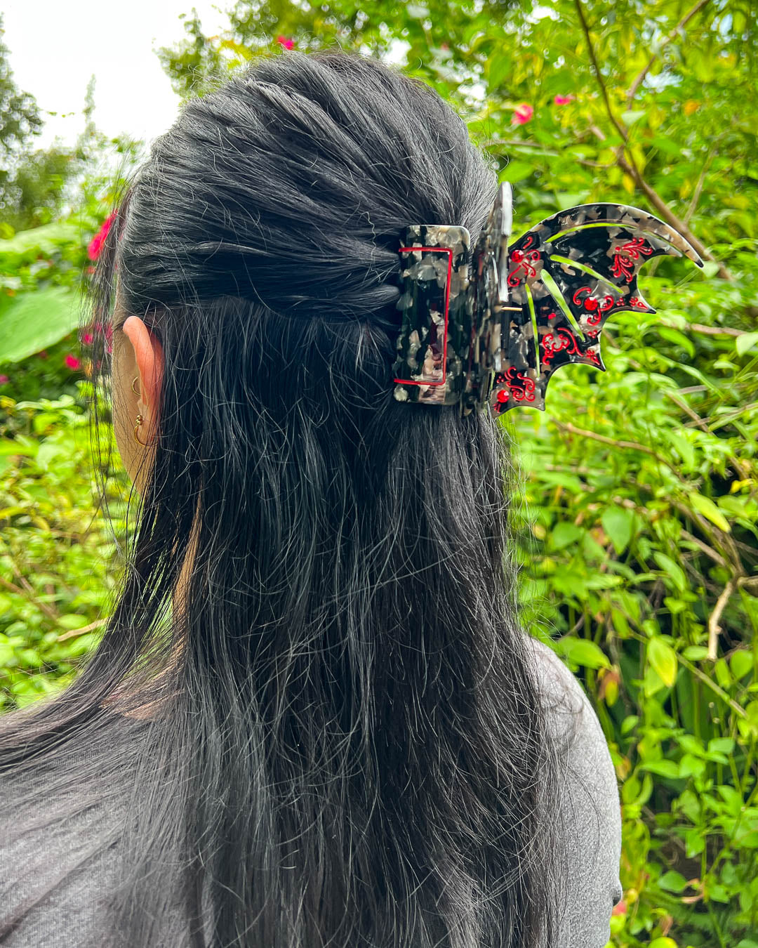 Hair clips for ACOTAR fans featuring red and black clips in shape of bat wings with gem embellishments and etching details.