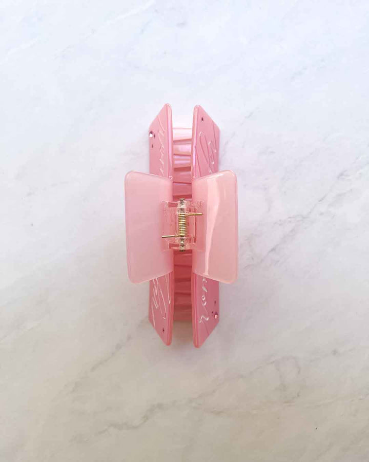Bookish claw clip with gold hinge, gem details, and &