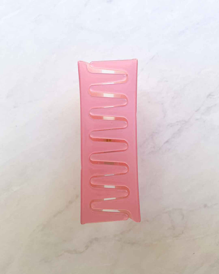 Romance claw clip featuring pink acetate material with &