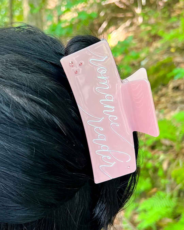 Romance hair clip featuring pink acetate material with &