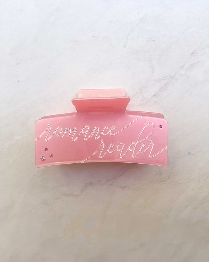 Bookish hair accessory for romance fans featuring gems, &