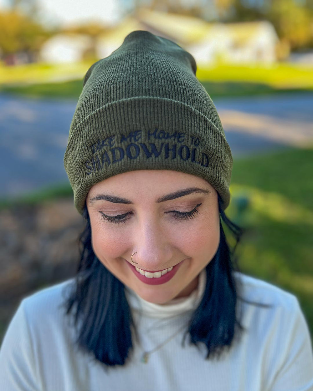 Embroidered A Dawn of Onyx beanie with the text 'Take me home to Shadowhold' on the front in green.