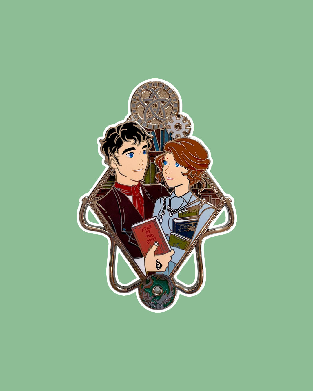 Shadowhunters enamel pin featuring Will and Tessa with a library background and both of them carrying books.