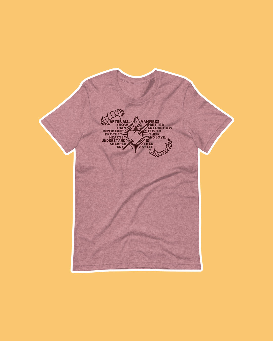 The Serpent & the Wings of Night tee featuring the quote 'After all, vampires know better than anyone how important it is to protect their hearts. And love, understand, is sharper than any stake' with two sets of fangs and a blazing heart speared through.