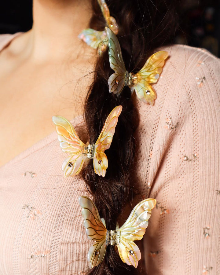 Fantasy mini hair clips for ren faire enthusiasts featuring fairy wing accessories in gold.