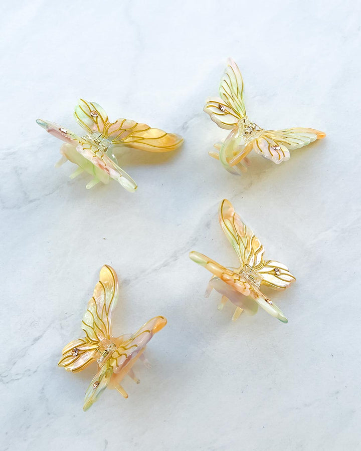 Four gold mini fairy clips for fantasy readers featuring gems and etchings.