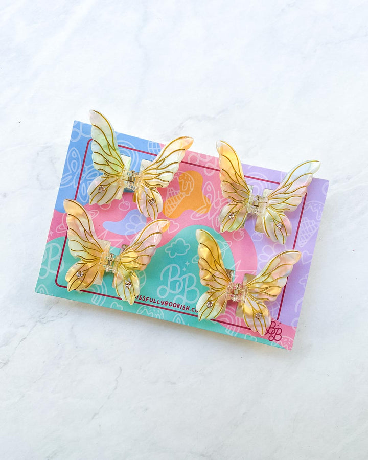 Fairy hair mini claw clips in iridescent gold with etching details and gem embellishments for fantasy fans.
