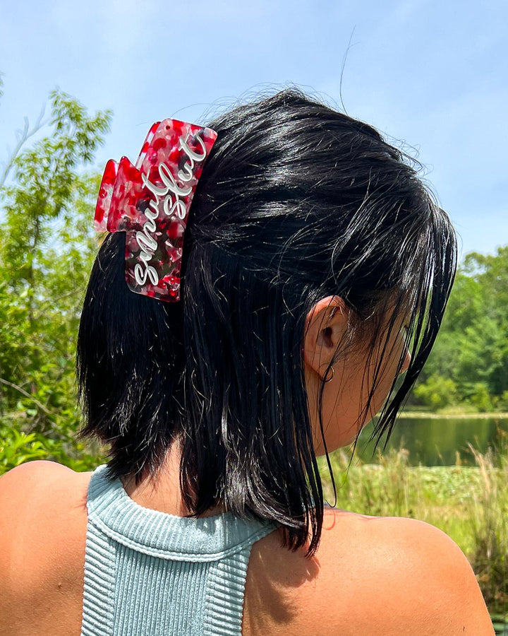 Bookish hair accessory with red, pink, and transparent details for romance readers with &