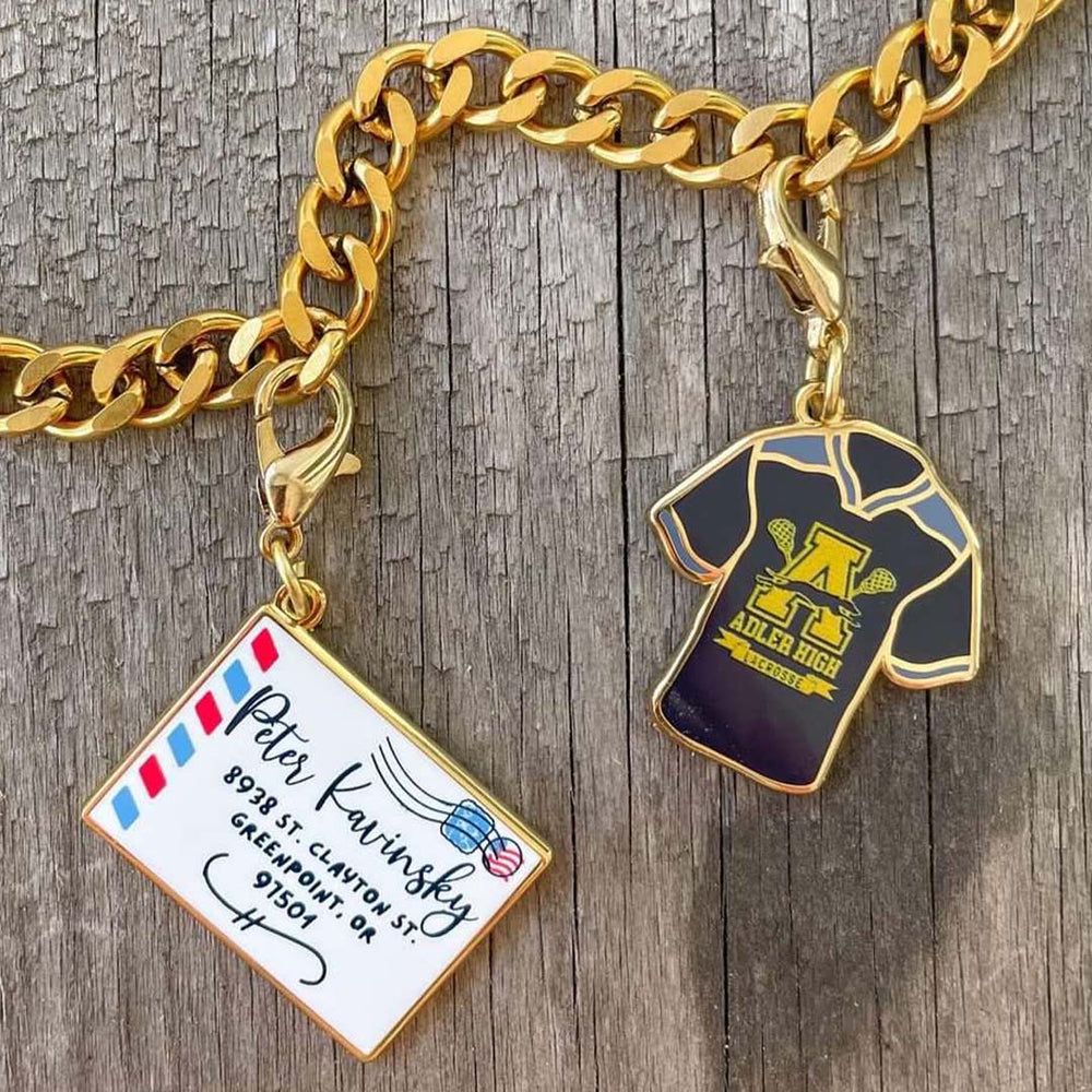 TATBILB charms featuring Peter Kavinsky's love letter and his lacrosse jersey.