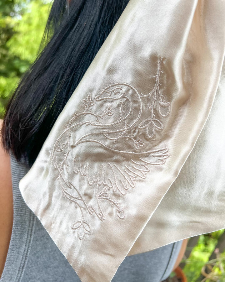 Satin bookish hair bow in ivory satin embroidered with a swan wrapped in ivy