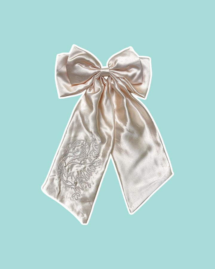 Embroidered satin bow for romantasy fans with a swan wrapped in ivy embroidered in a beautiful ivory color.