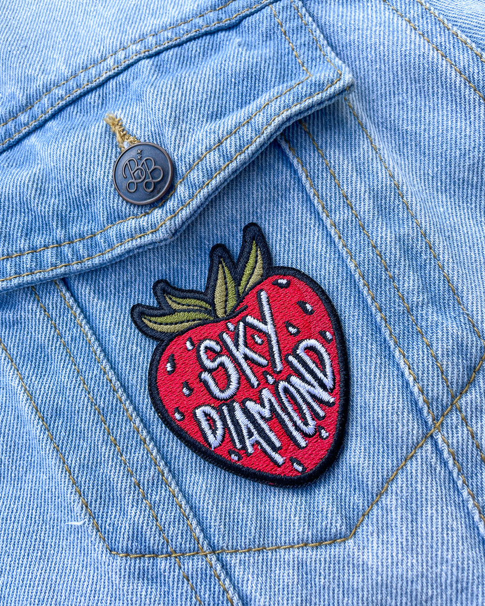 Sally Thorne patches for The Hating Game fans featuring a strawberry patch with the phrase 'Sky Diamond' on it.