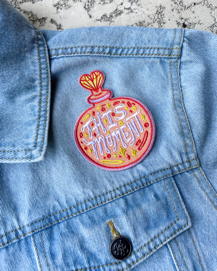 PWMOV patch for Emily Henry fans featuring a multi-colored perfume bottle with the phrase &