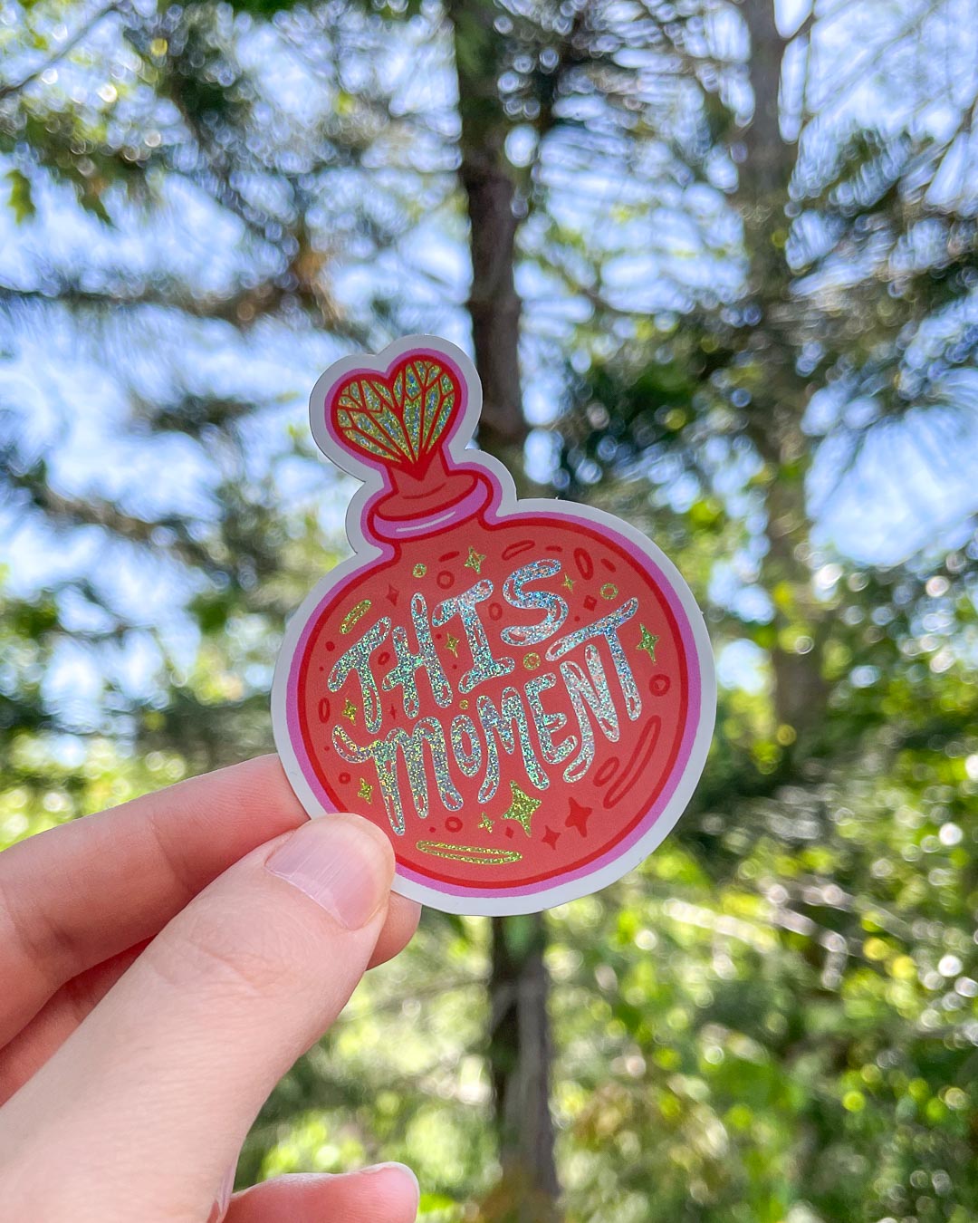 This Moment sticker for People We Meet on Vacation fans featuring glitter letters and details on a perfume bottle.