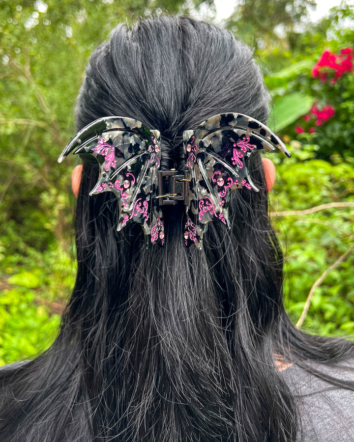 Violet A Court of Thorns and Roses hair accessory with purple gem embellishments and etching details.