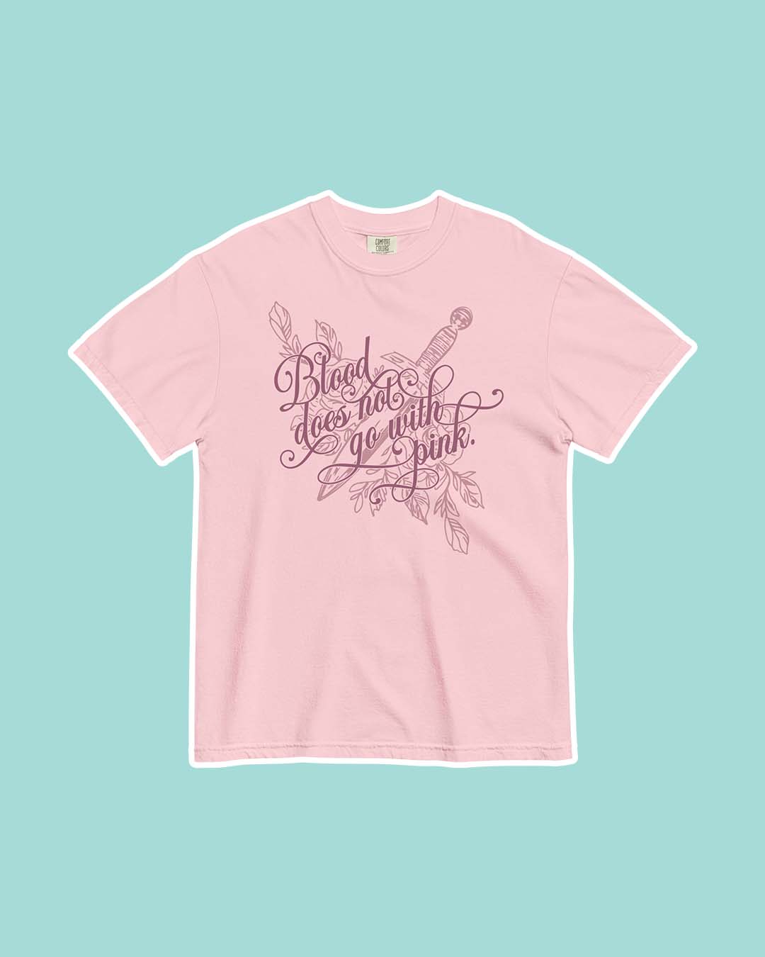 Enchantra shirt featuring an illustrated design of a dagger among roses with the quote 'Blood does not go with pink' on a pink t-shirt for Kaylie Smith fans.