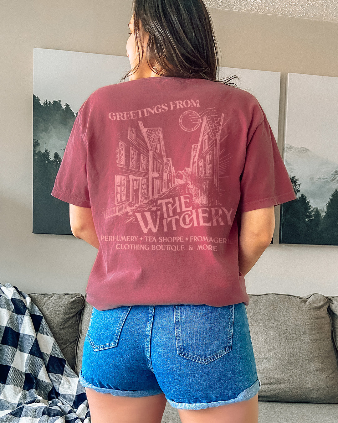 Rachel Griffin shirt featuring the back of the Witchery pocket tee with a design of the town from Bring Me Your Midnight.
