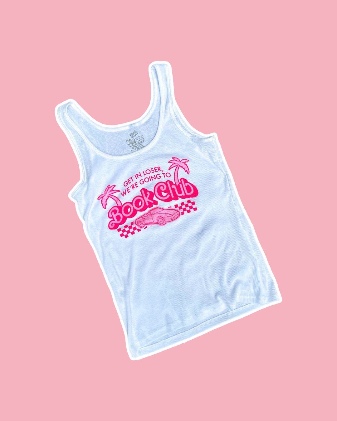 White bookish tank top with a pink design of palm trees, a car, and a finish line with the quote 'Get in loser, we're going to book club.'