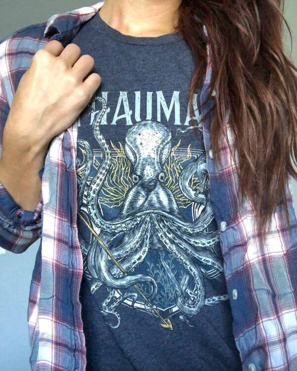 person wearing the thaumas family crest boyfriend tee with flannel