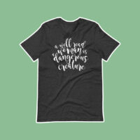a well read women is a dangerous creature boyfriend tee on green background with dark grey tee with white script font design