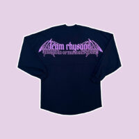 Black long sleeve shirt with purple design across shoulders laid on a purple background.