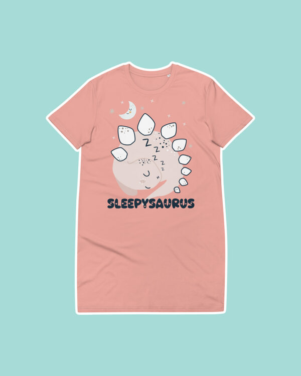 pink sleepysaurus night tee with design of cute dinosaur against a blue background