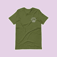 green shirt on a purple background with a embroidered design reading "the unity project".